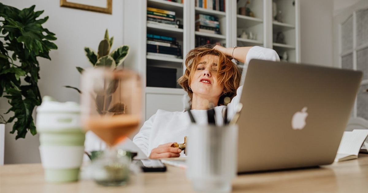 Woman trying to concentrate on work while juggling several tasks