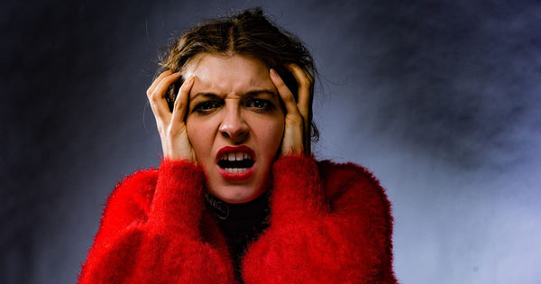 Frustrated woman in red sweater
